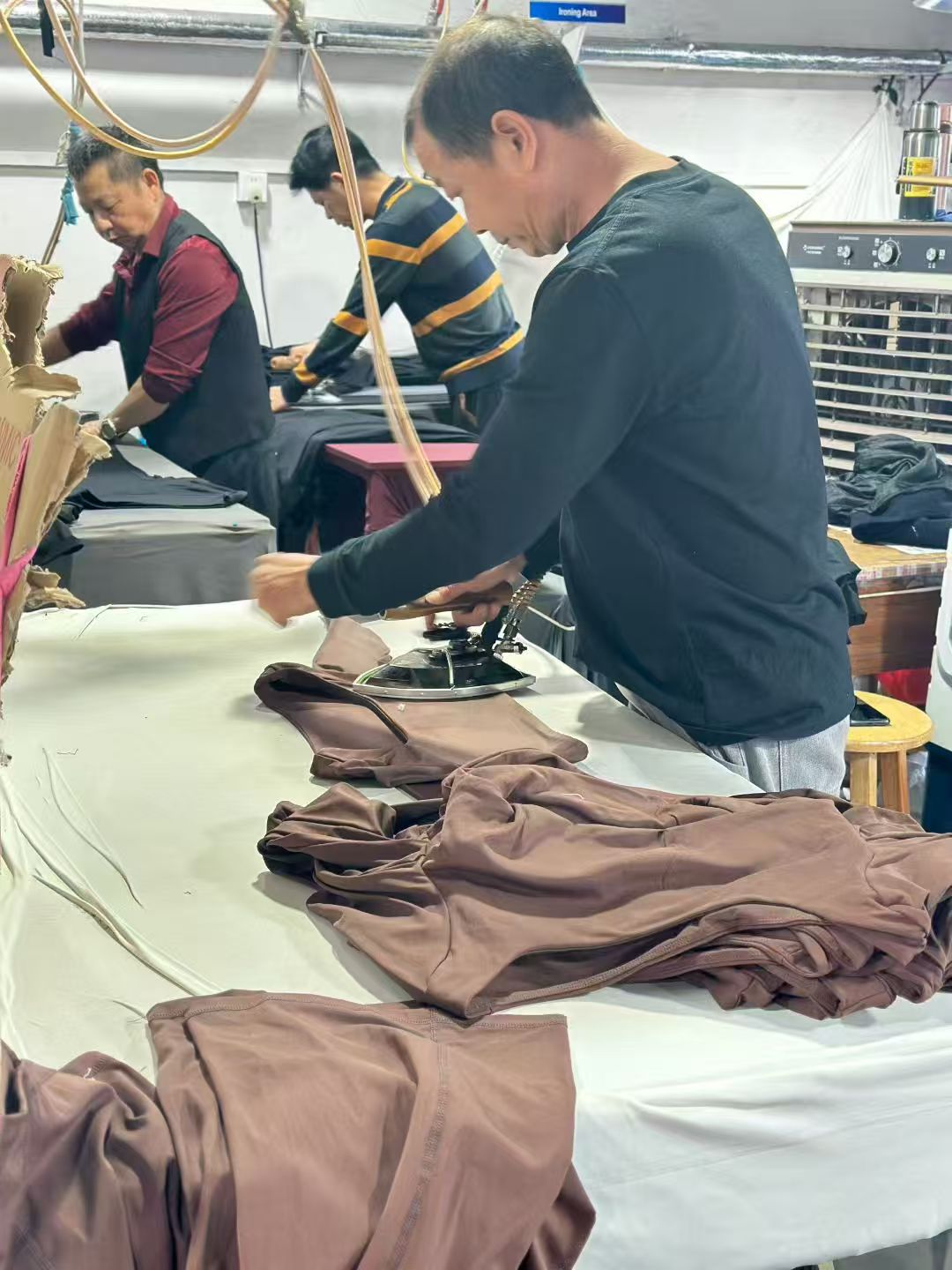 Garment ironing and final preparation before packing