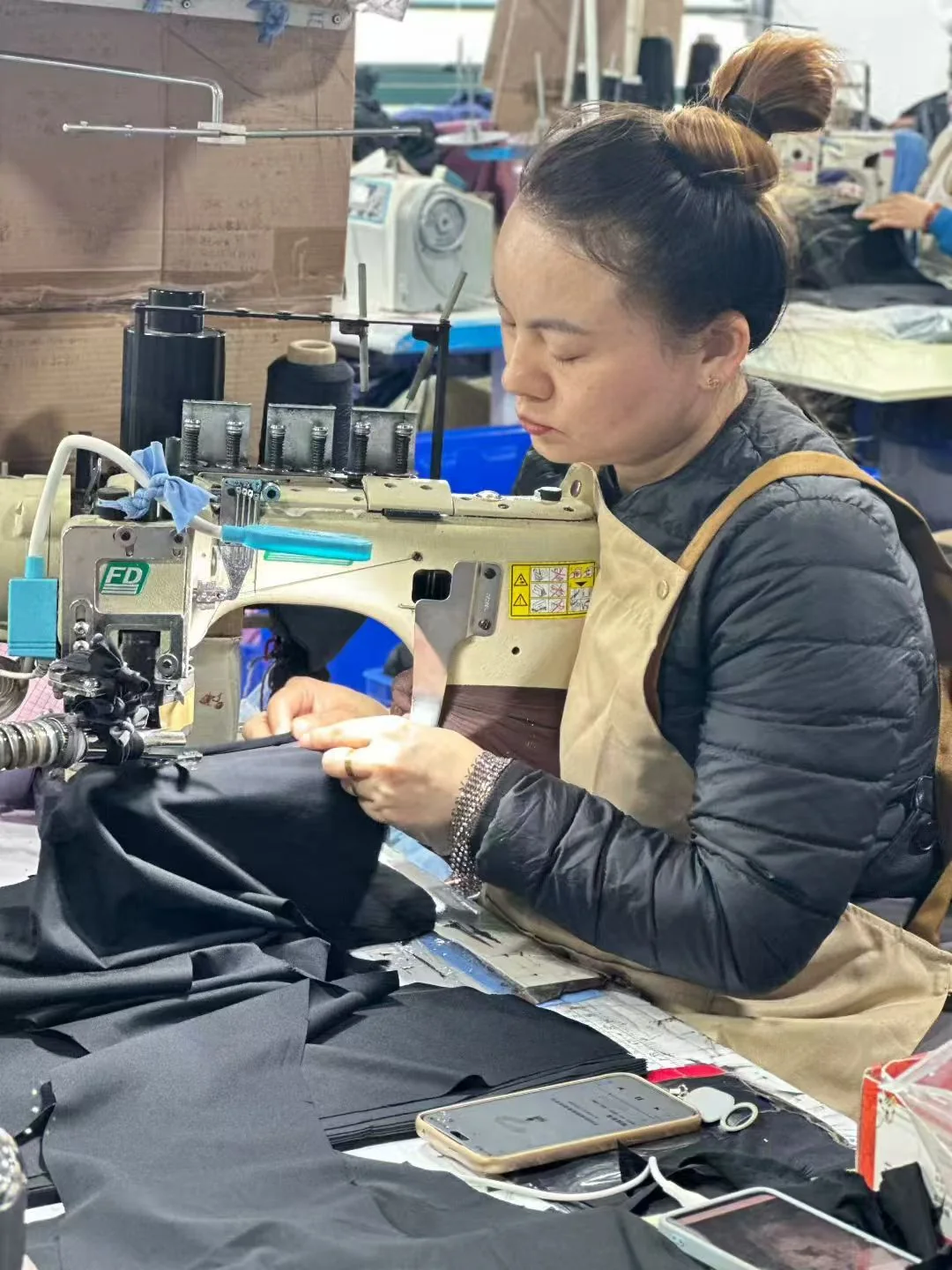 Garment sewing at a workstation
